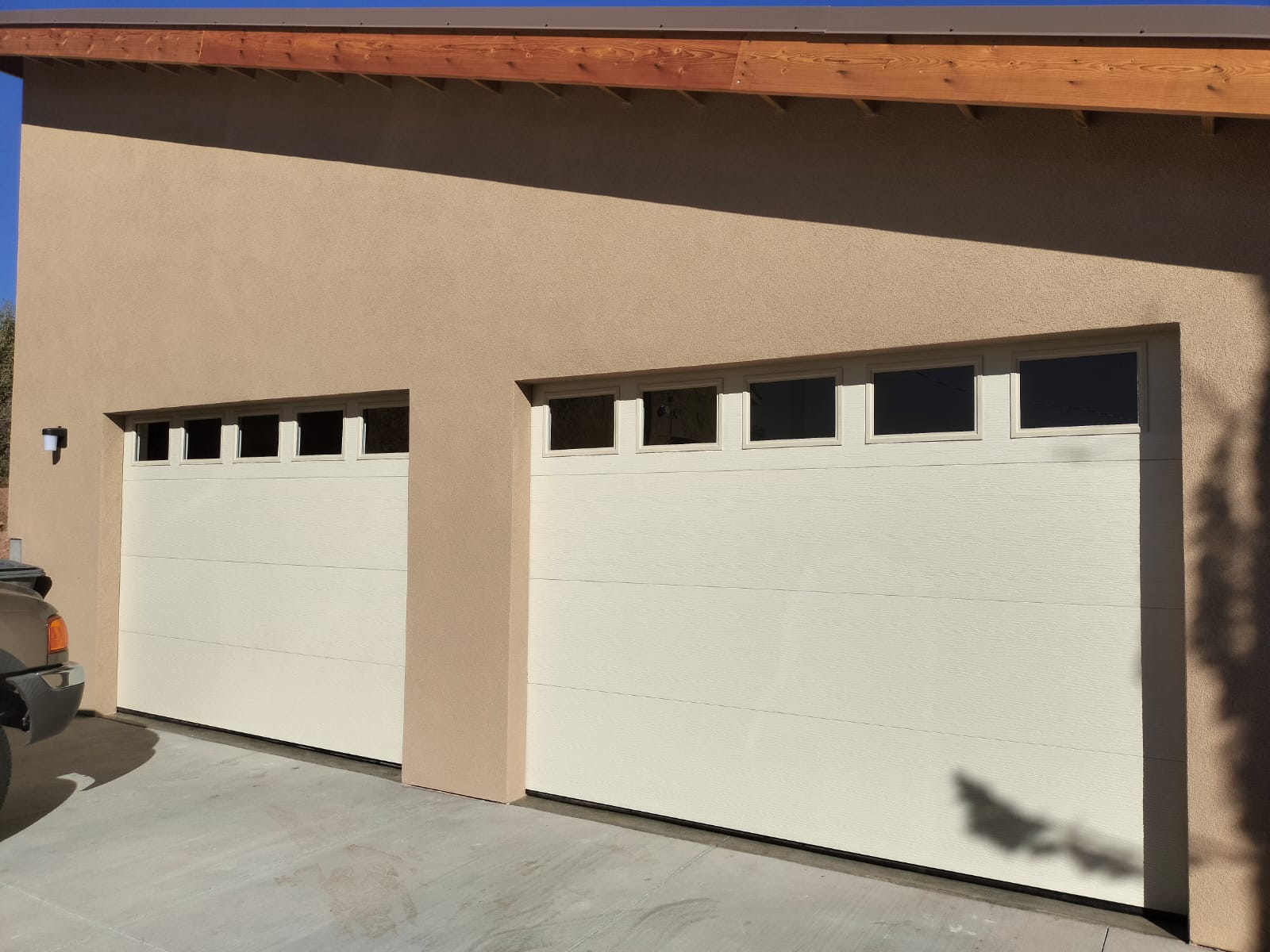 Finished garage door installation with windows on a St. George area home